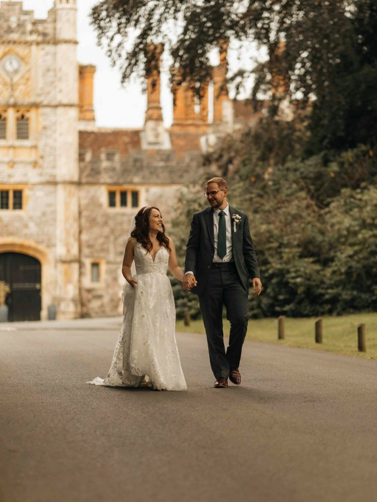 Couple walking together at an elegant historic wedding venue