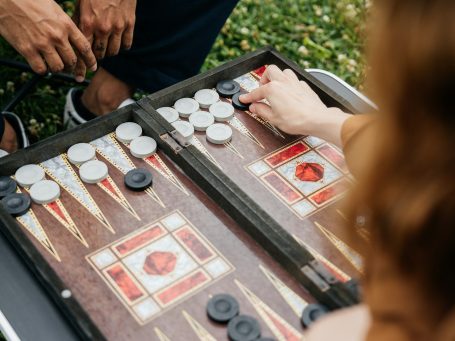 Couple enjoying a traditional board game at a wedding celebration